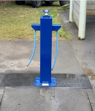 An image of a blue water fountain bollard in Awhitu, Auckland. 