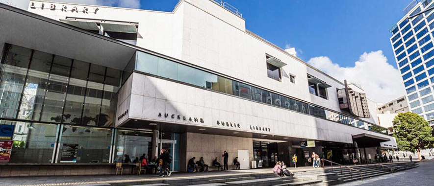 Exterior view of Auckland Central Library, showing the building and the steps leading to the front doors.