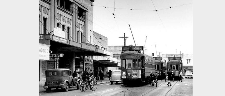Trams, cars, cyclists and pedestrians pass by Sandringham shopping centre's Edendale cinema in the 1950s.