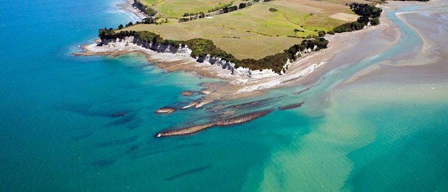 An aerial view of a sediment plume off the coast of Auckland