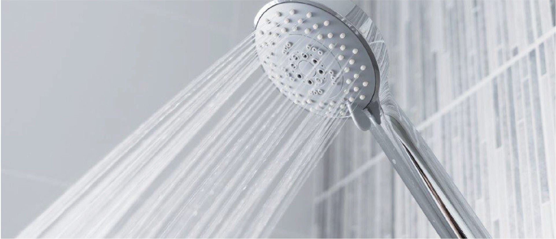 Shower head spouting a large jet of water.