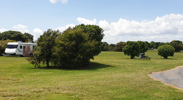 Ambury Campground - Camping area with caravan.