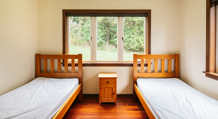 Craw Homestead - Bedroom with two single beds.