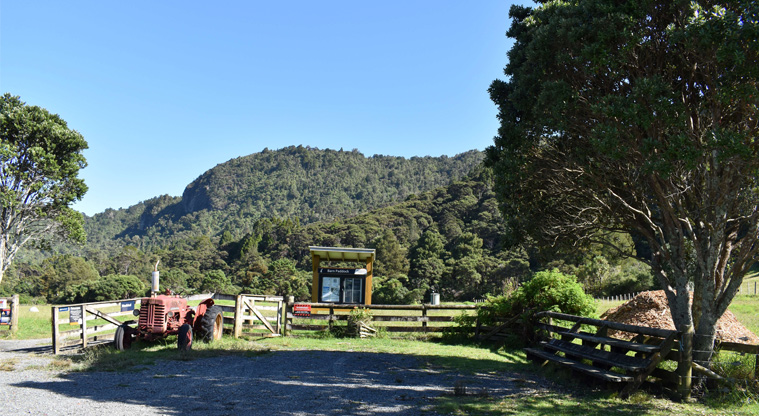 Barn Paddock CSC overnight parking area — Carpark with noticeboard by the edge.