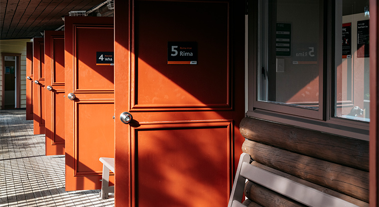Huia Lodge - Bunkroom doors opening on to the veranda.
