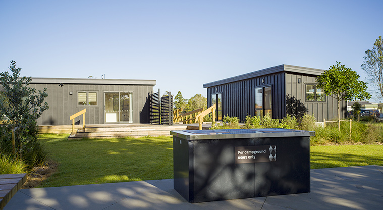 Te Kopua tiny home - Barbecue and garden area behind the tiny homes.