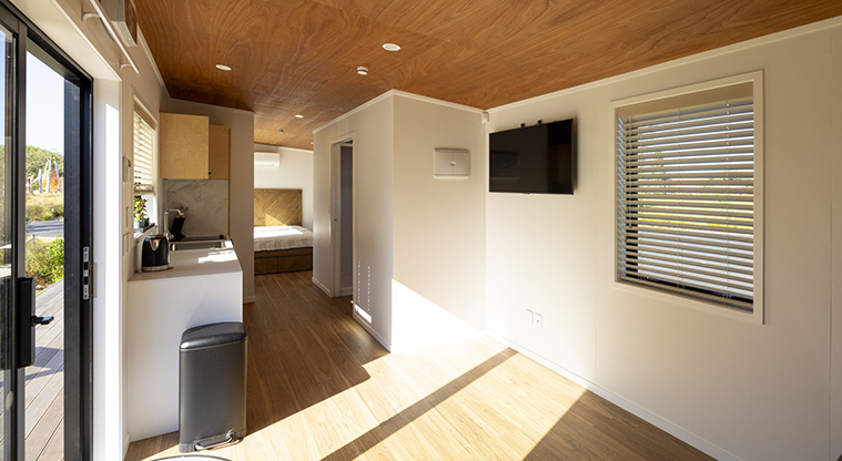 Te Kopua tiny home - View from the living area, past the kitchen and into the bedroom.