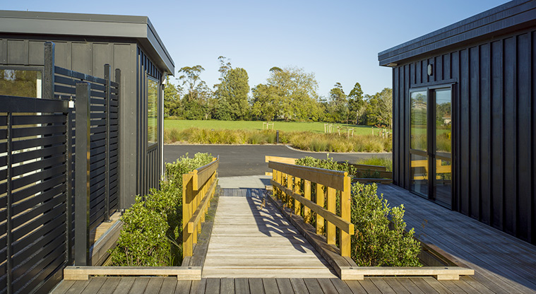 Te Tino tiny home - The accessible ramp leading down to the road between the two tiny homes.