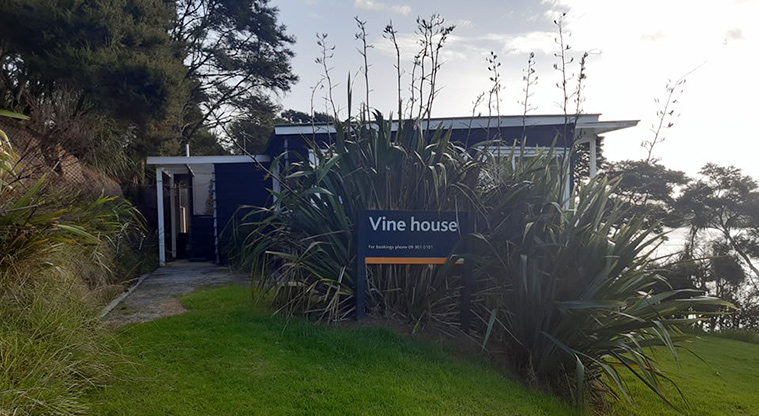 Vine House - External view of the house and the sign.