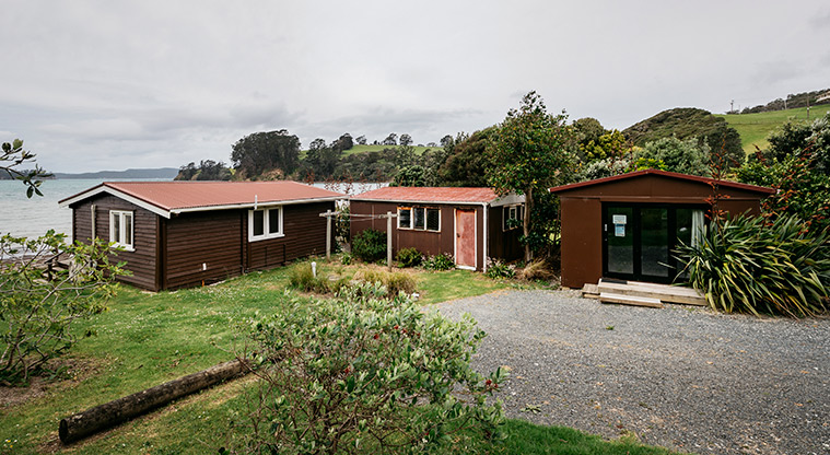Moonlight Bach - Exterior of the bach showing the main building and sleepout.