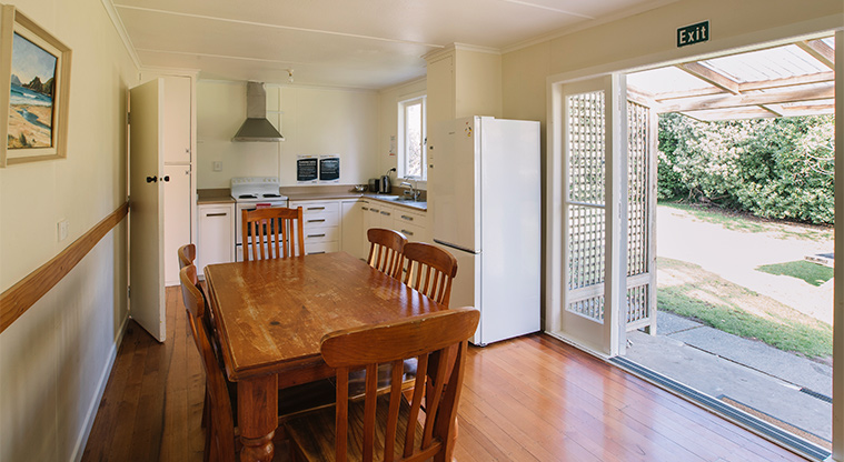 Tāwharanui Bach - Kitchen and dining area.