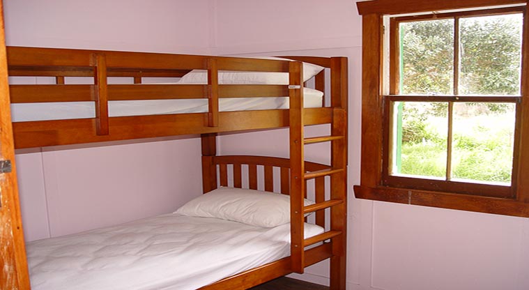 Puhoi Cottage - One of the two bunk rooms.