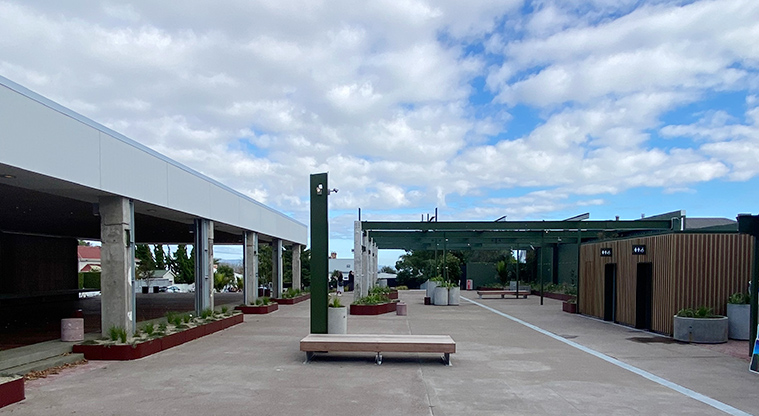 Paved area with buildings on both sides.