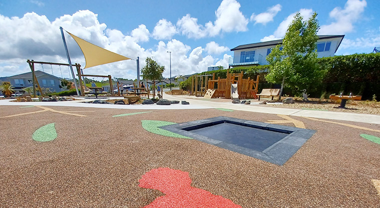 86 Harvest Avenue - In-ground trampoline with the playground in the background.