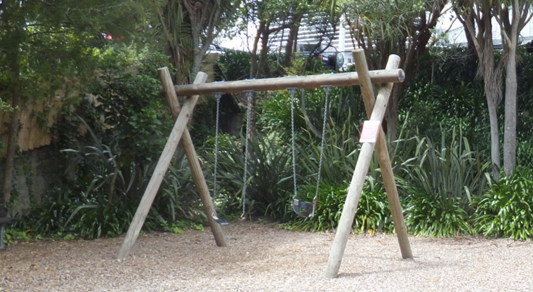 Aitken Reserve - Set of two swings with trees in the background. Photo credit: J Grigg.