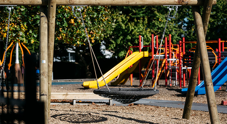 Allenby Park – Bucket swing with slides and climbing equipment in the background. Photo credit: Jay Farnworth