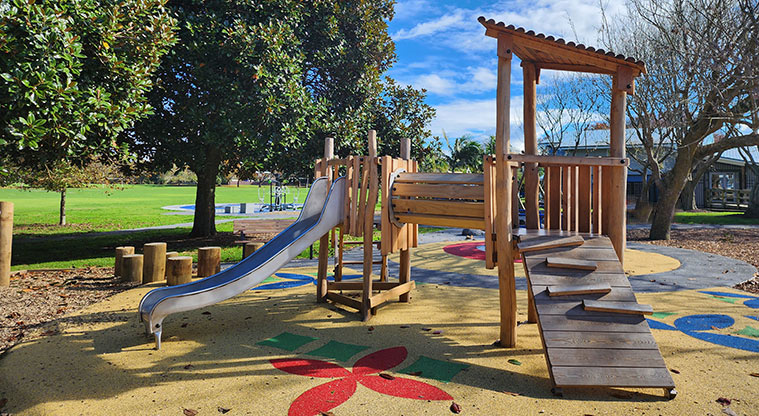 Aorere Park - Junior play module showing the climbing ramp, low slide and crawl tunnel.