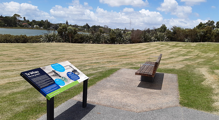 Archibald Park - Interpretive sign and accessible seating overlooking the river.