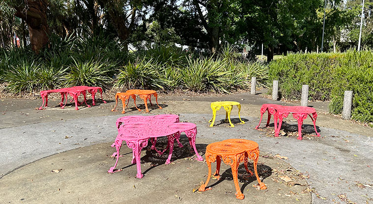 Ballantyne Square - Colourful decorative seats on the footpath on the Dominion Road side of the reserve. Photo credit: S Hulse.