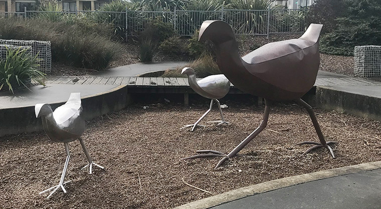 Barry Curtis Park - Three large pūkeko sculptures in the play area.