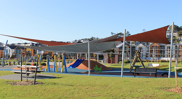 Bonair Crescent Stormwater Pond - Junior play area with slides, rocker toy, basket swing, and seesaw covered with shade sails. Photo credit: M Loubser.