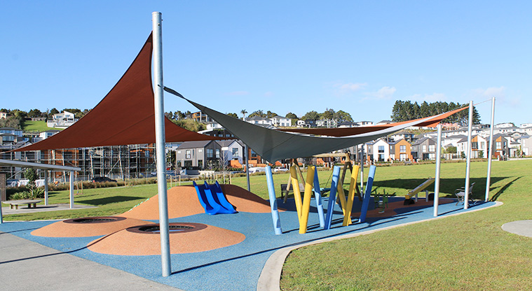 Bonair Crescent Stormwater Pond - Junior play area with slides, rocker toy, basket swing, and seesaw covered with shade sails. Photo credit: M Loubser.