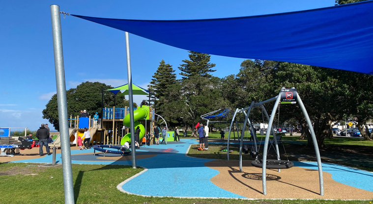 Browns Bay Beach Reserve - Shaded swings, including an accessible basket swing. Photo credit: T Hodder.