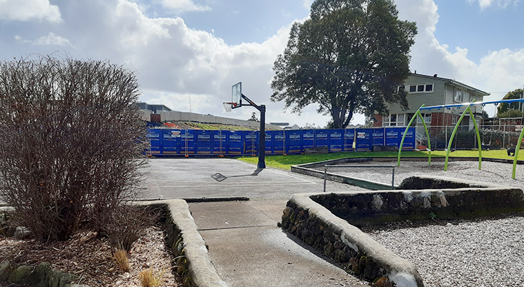 Puāwai / Cadness Reserve - A section of the basketball court and a set of four swings. Photo credit: S Hulse.