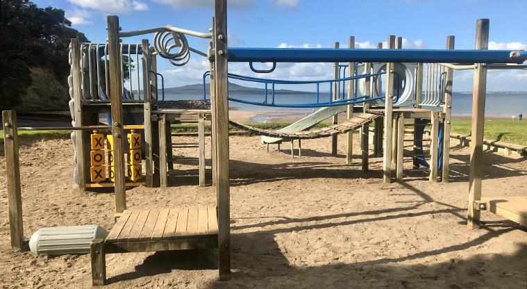Castor Bay Beach Reserve - Part of the playground with climbing equipment, interactive toys, wobbly bridge and more.