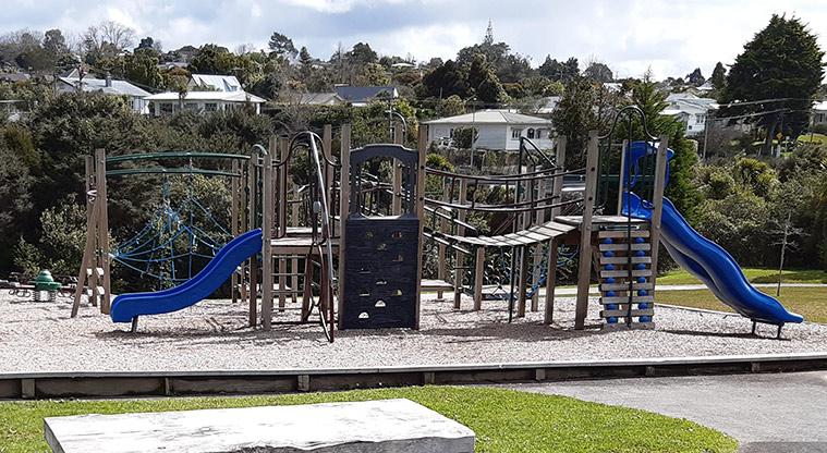 Ō-kauri-rahi / Ceramco Park - Climbing equipment with slides at either end, and a climbing net in the background.