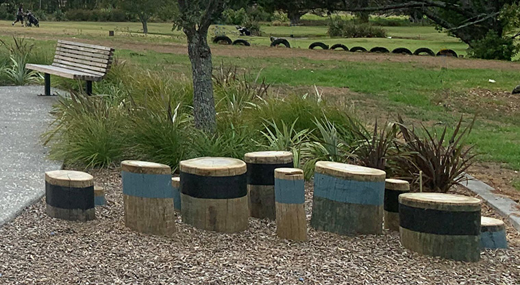 Ngahere Ki Uta / Clarks Beach Recreational Reserve and Golf Club - Log stumps in the nature play area for stepping or jumping across.