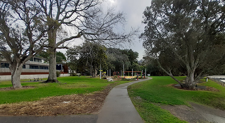 Cockle Bay Reserve - Section of path leading north towards the playground, open space and trees.