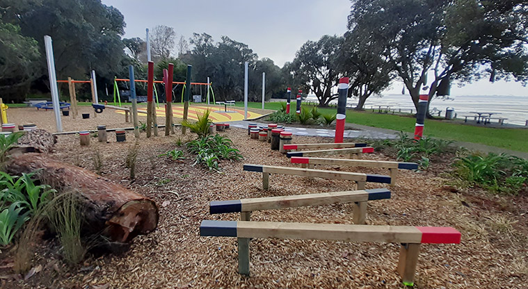 Cockle Bay Reserve - Colourful balance beams running down the middle of the nature area.