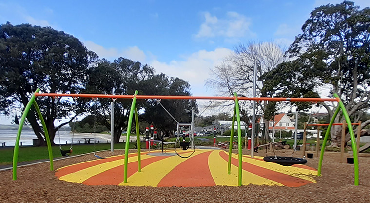 Cockle Bay Reserve - Swing set with four swings including a basket swing, and one for parent and child.