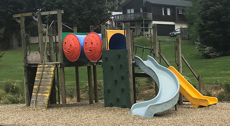 Colin Lawrie Fields - Playground with climbing equipment, tunnels, slides, and swings.