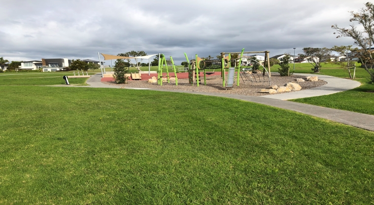 Constellation Park – Playground with slide, swings and climbing equipment.