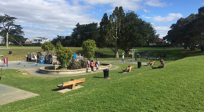 Coyle Park – a gradual grassy slope down to seating and the children’s playground.