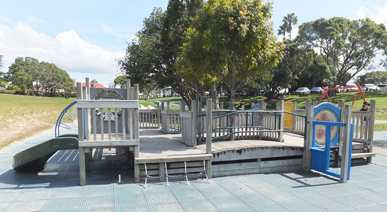 Coyle Park - Wooden fort type playground with ramps, slides, climbing bars, and more. Photo credit: J Grigg.