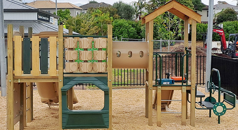 Crossfield Reserve - Junior play module with crawl tunnel, interactive play boards, slides and climbing equipment.
