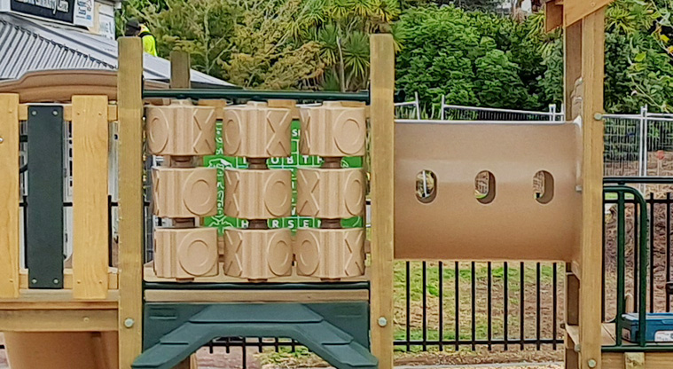 Crossfield Reserve - Interactive play boards and crawl tunnel in the younger children's play area.