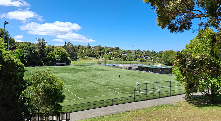 Tahurangi / Crum Park - Looking down the hill at the large artificial turf sports fields and the courts in the background. Photo credit: T Hodder.