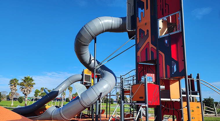 David Lange Park - Section of the high play module with a spiral tube slide, viewing platforms and climbing equipment.