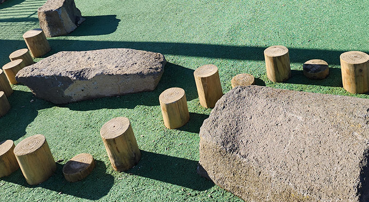 David Lange Park - A series of low stumps for balancing and rocks for climbing on.