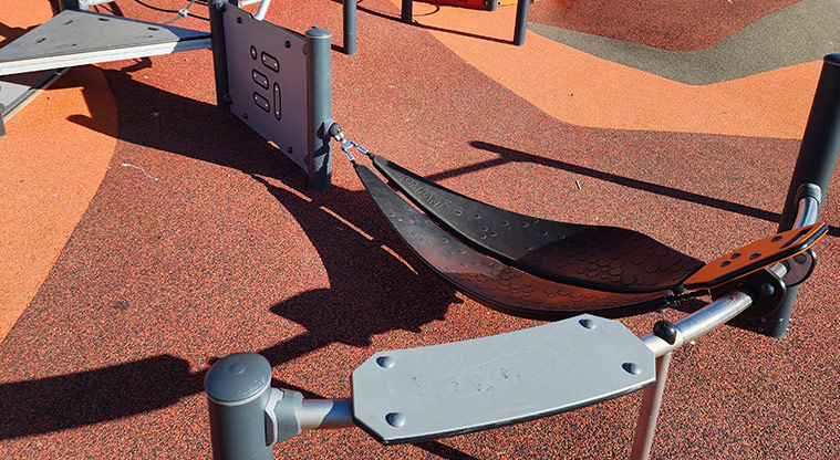 David Lange Park - Low sling swing by the steps leading up into the junior play module.