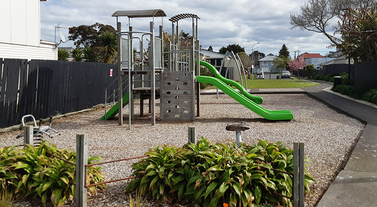 Delphine Close - Playground with a path leading to open green space in the background. Photo credit: S Hulse.