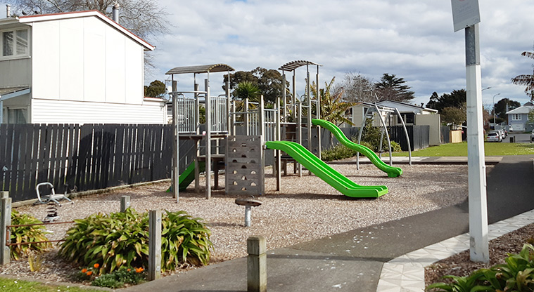 Delphine Close - Playground with a path leading to open green space in the background. Photo credit: S Hulse.