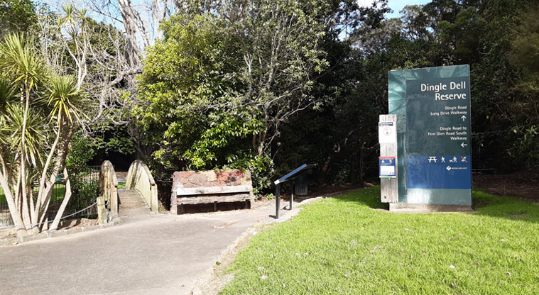 Dingle Dell Reserve - Sign near the Dingle Road entrance to the reserve. with a section of path and a small bridge.