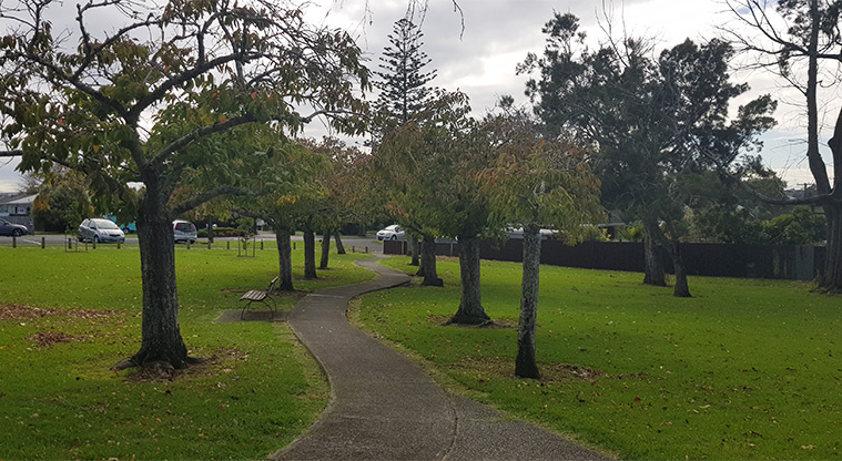 Eastdale Reserve - Section of path lined with trees and with seating along the edge.