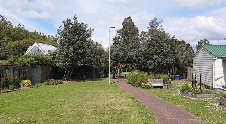Francis Reserve - Section of the path through the park, with a seat and light next to it. Photo credit: T Hodder.