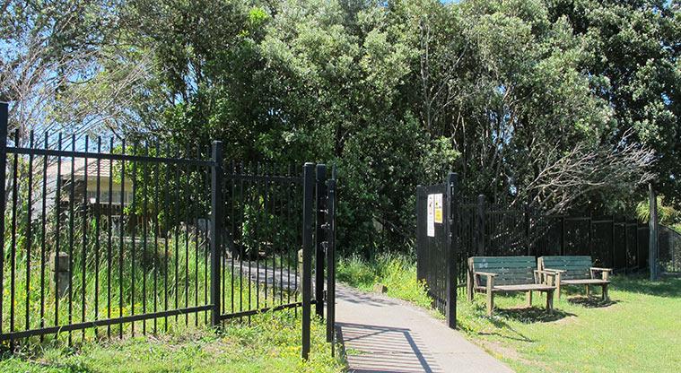 Gittos Domain - Gate and seats at the entrance to the park.